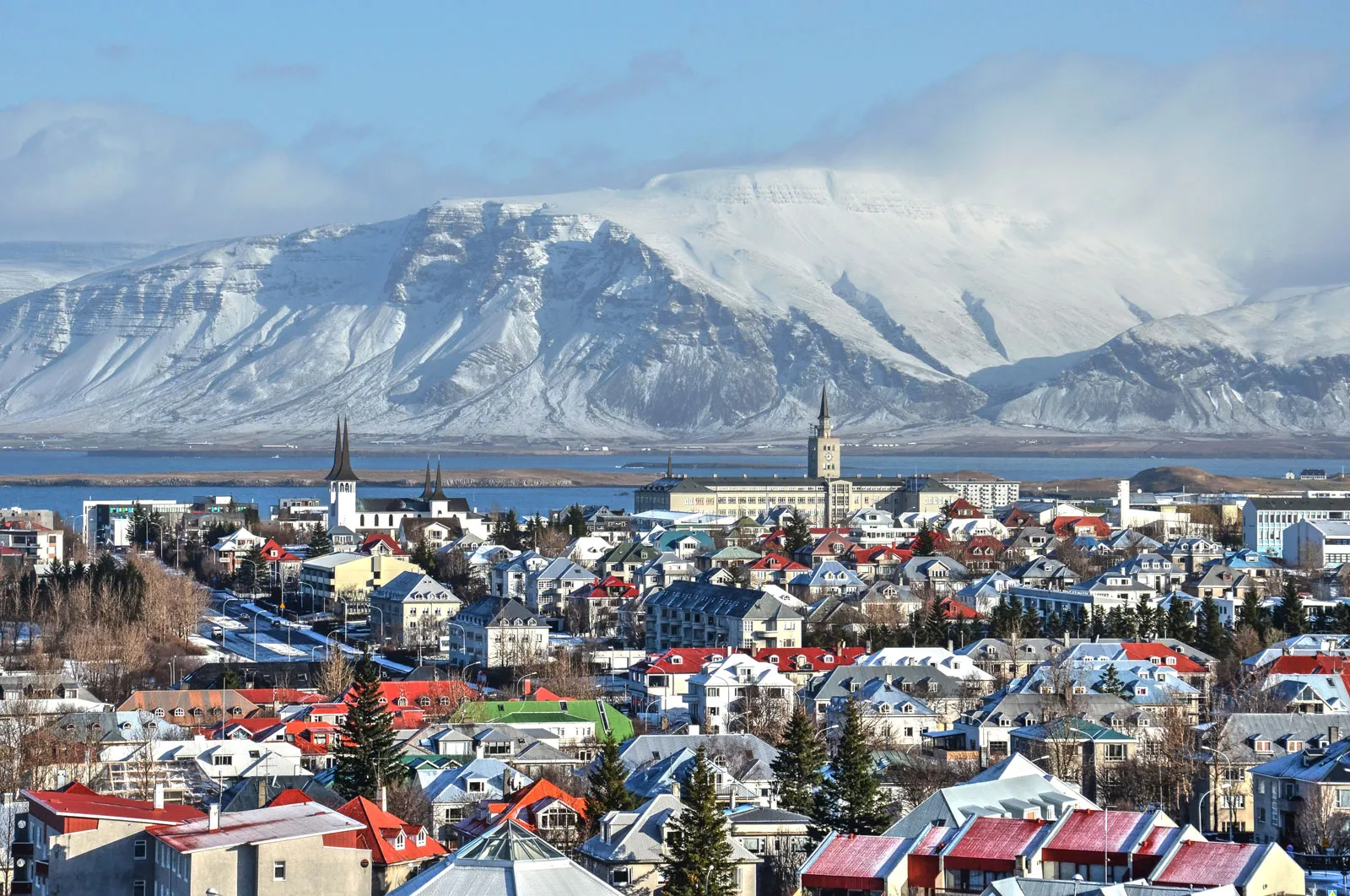 View of colourful buildings in Reykjavik, Iceland; with mountains in the background 