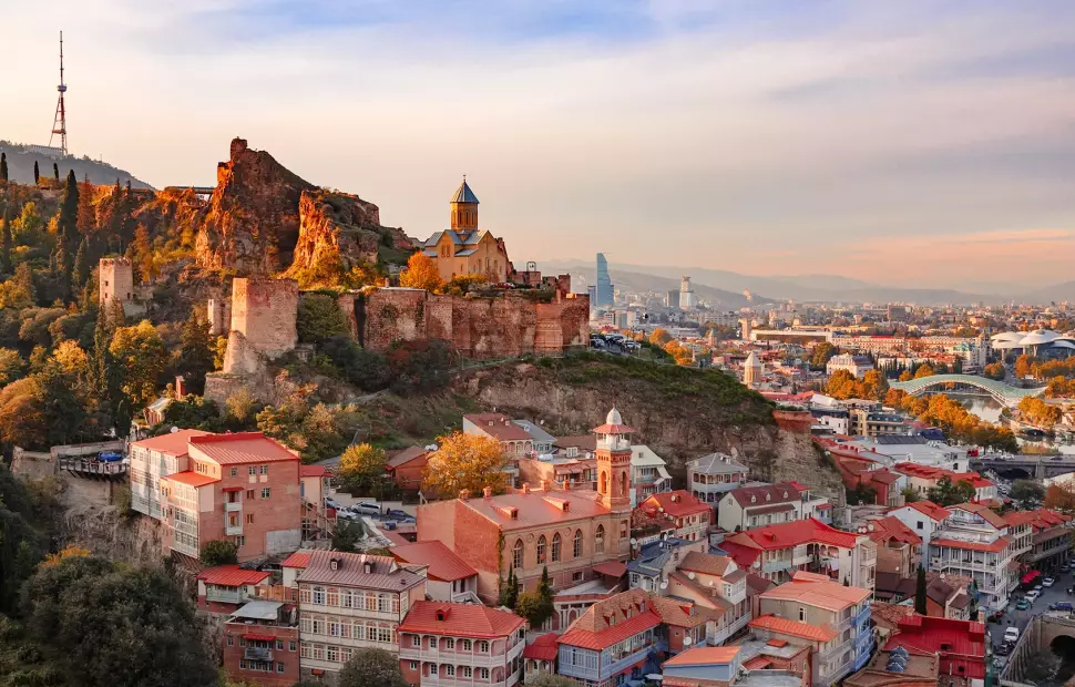 Red tile roofed buildings on a large hill in Georgia 