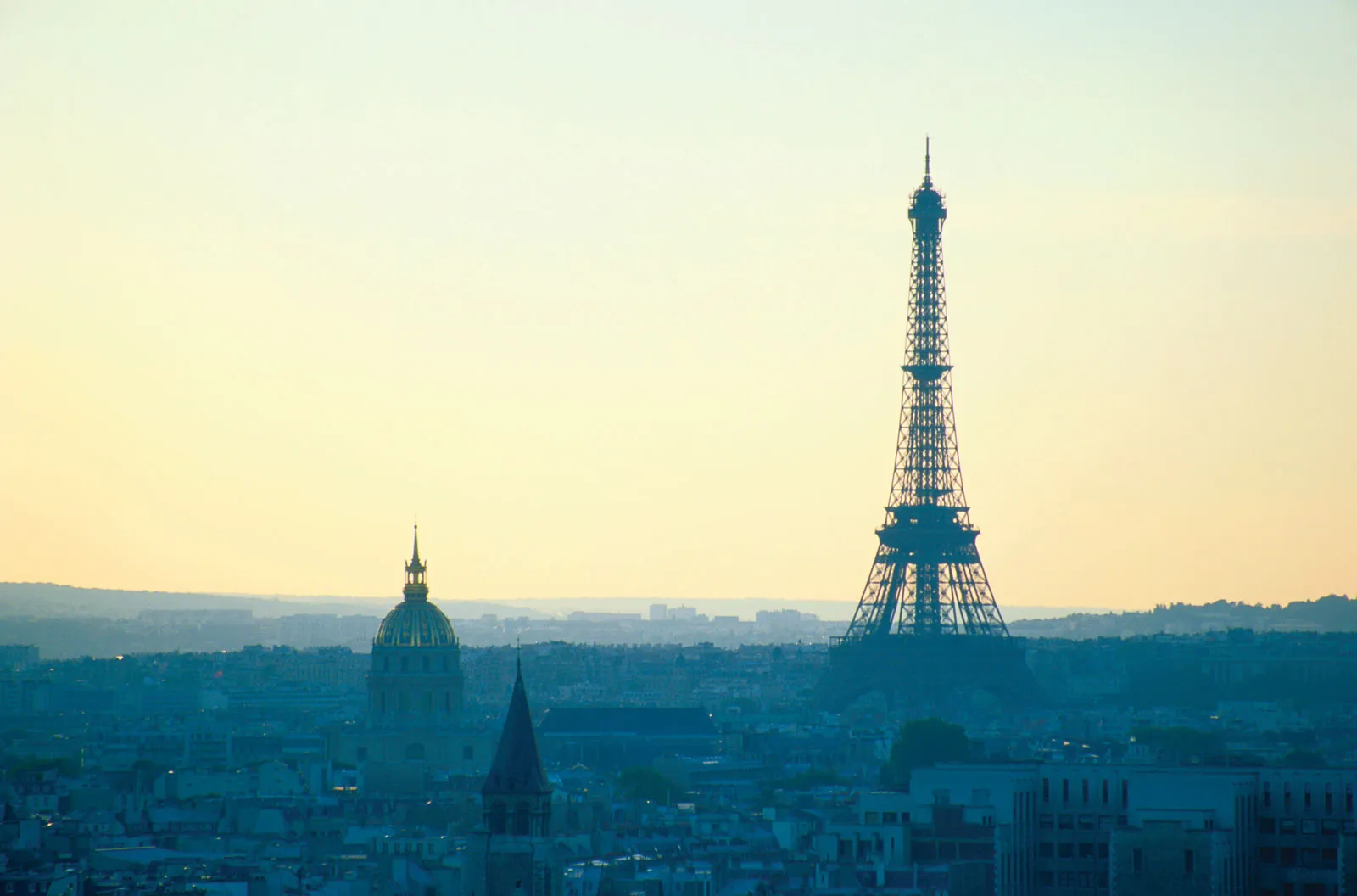 Eiffel tower under overcast clouds